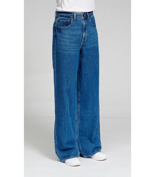 Les jeans larges de performance originaux - Denim bleu moyen.